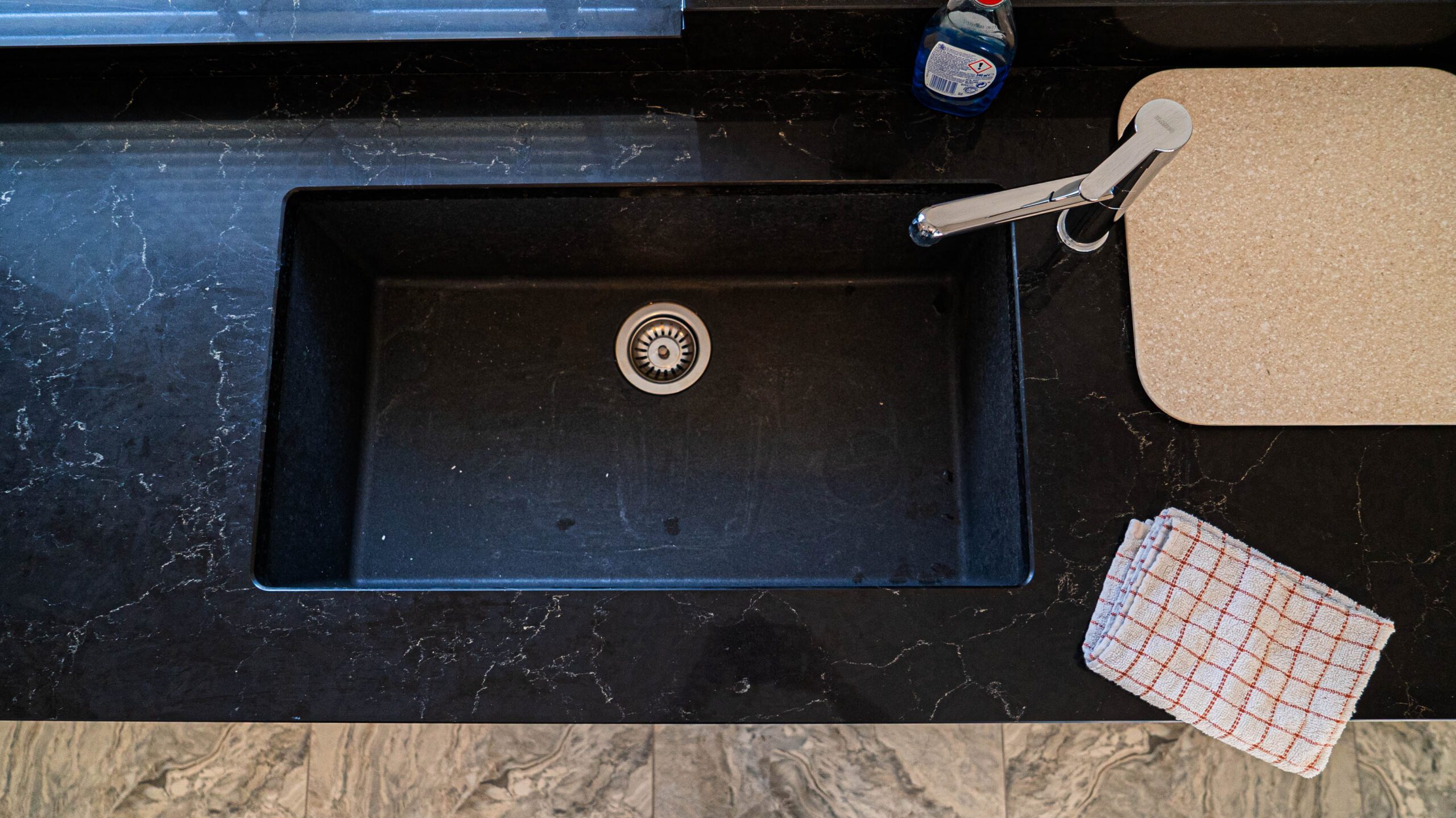 Emperor Black Quartz worktop with undermount sink cut-out and draining area in a dark veined finish