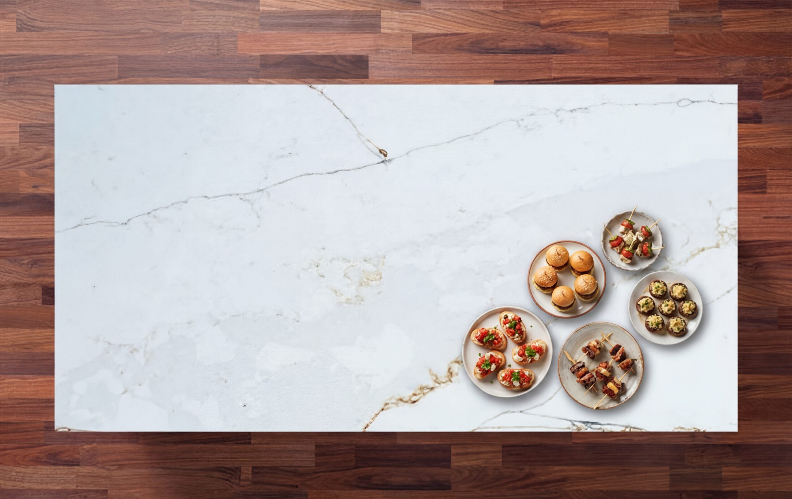 Overhead view of Ethereal Calacatta Quartz worktop showing gold and grey veining on a bright white surface with food dishes