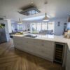 Aspen Shimmer Quartz worktops in a modern open plan kitchen with island seating