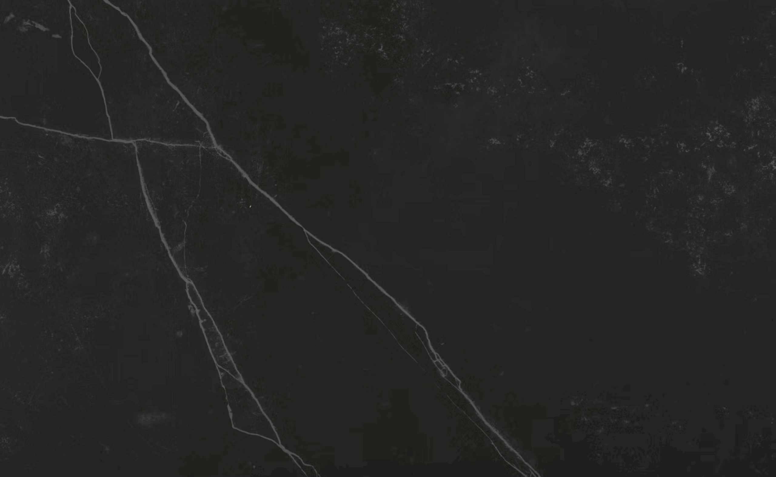 Close up of Kelya Porcelain in deep charcoal with fine white veining and subtle speckling