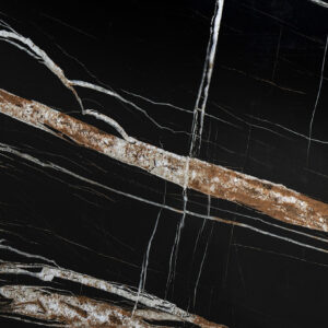 Noir St Laurent Porcelain worktop slab close up showing deep black surface with bold gold veining, styled with food and accessories