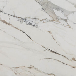 Macchia Antica Porcelain slab detail with sweeping gold and grey veining on a bright white background