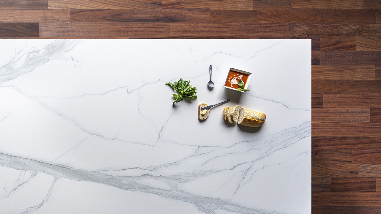 Volakas White Porcelain slab close up showing soft grey veining across a bright white background