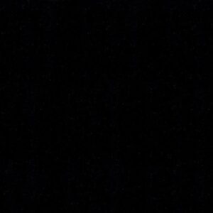 Close up of Absolute Black Granite worktop surface showing the consistent black colour and glossy polished texture.