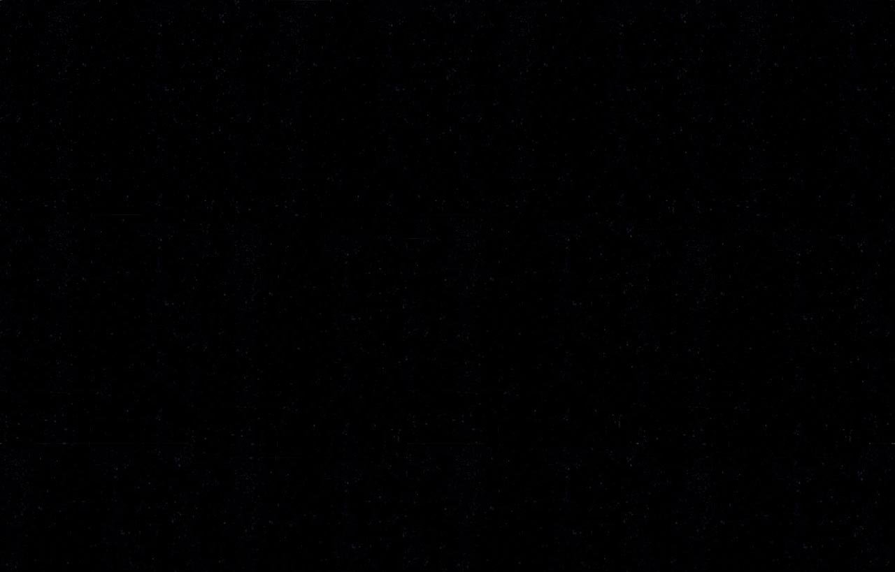 Close up of Absolute Black Granite worktop surface showing the consistent black colour and glossy polished texture.