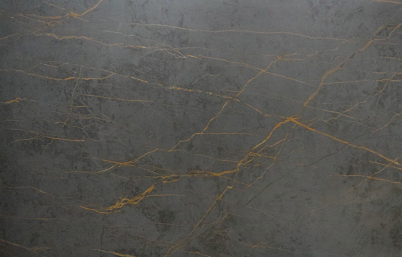 Gold Laurent Porcelain slab close-up showing bold gold veining across a dark grey surface
